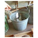 Galvanized bucket full of glass med. bottles