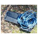 roll of air hose & Creeper