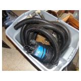 Tote Full of Pumps and Hose