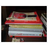 Stack of Coca-Cola Price Guides, Cook Books, Plus