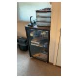 Glass Front Cabinet Full Of Office Supplies