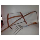Group of 3-pitchfork, cross-cut saw, scythe