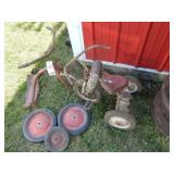 Two partially assembled trikes, 2 red wheels w/