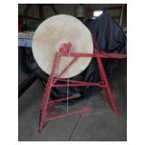 antique pedal grinding stone on red metal stand