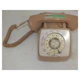 tan color dial type desk top phone