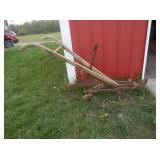 prim.  rusty wood handled horse drawn cultivator