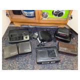 Several digital clocks, CD players and radios