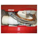 Tote with assortment of plumbing supplies