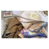 Box of misc table linens, apron