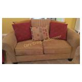 Tan Suede Love seat with minor damage