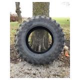 Firestone 20.8x38 Tire, has small cut in sidewall,