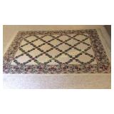 Floral Area Rug 92' X 64' IN THE BASEMENT