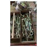 Metal tool box full of wrenches