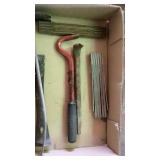 Assorted pry bars and fold up measuring tapes