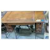 Antique Singer sewing machine with cabinet