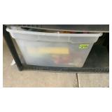 Tub full of  paint brushes, paint roller, perm