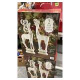 2 boxes of decorative deers