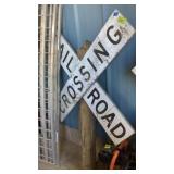 Railroad Crossing sign on wood post