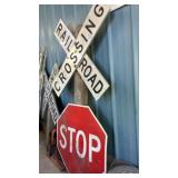 Railroad Crossing and Stop signs on wood post