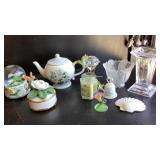 Box of home decor items: candlesticks, plates,