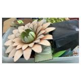 Tub of lawn and garden items: hose, metal decor,