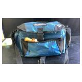 Gander mountain bag full of fishing supplies and