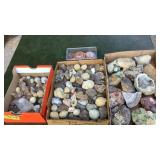 3 flats of rocks and container of button pins