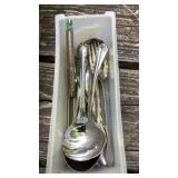 Strainers, glass vase, nutcracker, flatware