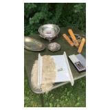 Mesh basket with silver plated item, playing