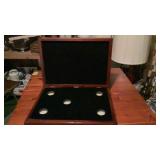 Unique wood case (coins or napkin rings?) will