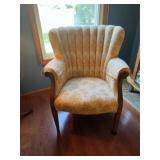 Older wing back style living room chair, wood down