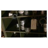 large assortment of trash pump hose fittings