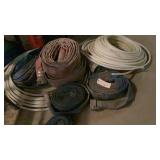 large assortment of trash pump hose
