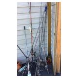 Fishing poles & net, yard rake, small tire,