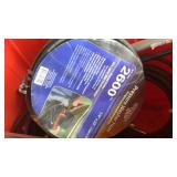 Tub of pressure washer wands, hose, ice scraper