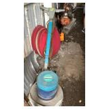 Wetrok floor polisher with pads