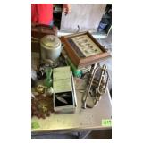 Trumpet, knifes, ashtray, owl, lunch box, oilers,
