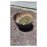 Cast iron pot on stand, outdoor decor