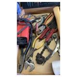 Flat of misc tools, battery charger, animal leg