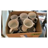 Coffee mugs, old grocery store basket with ivy,