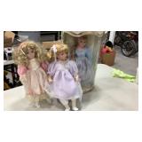 Porcelain dolls, one NIB