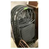 6 black folding chairs with cushioned seats