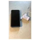 Samsung phone in Otter box and charger