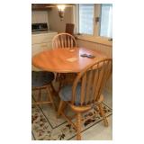 Table and 4 chairs 42" round with drop down sides