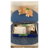 Box of miscellaneous items, book ends cat