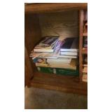 TV shelf & contents, folders, VCR, tape reminder,