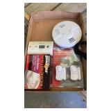 Smoke detectors, binoculars by Alpine, window