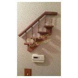 Stair step wall shelf