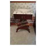 Small mahogany table with marble top
