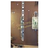 2 Levels on wall over tool bench